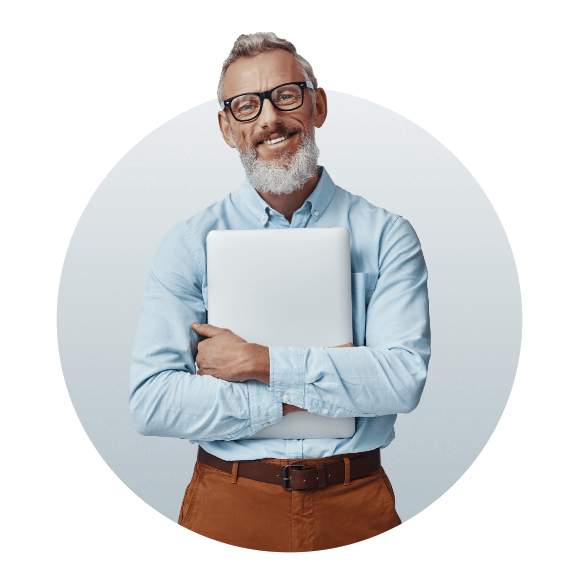 A professional wearing a blue shirt holding a laptop.