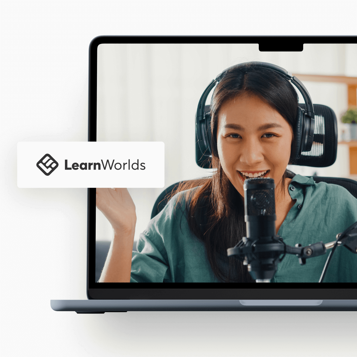 A female presenter wearing headphones smiling and speaking in front of microphone on a laptop screen.