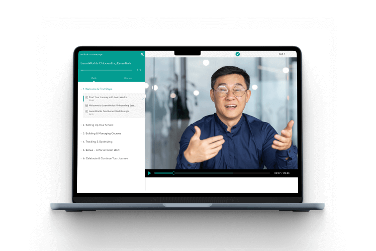 Laptop showing a video lesson with an instructor on screen.