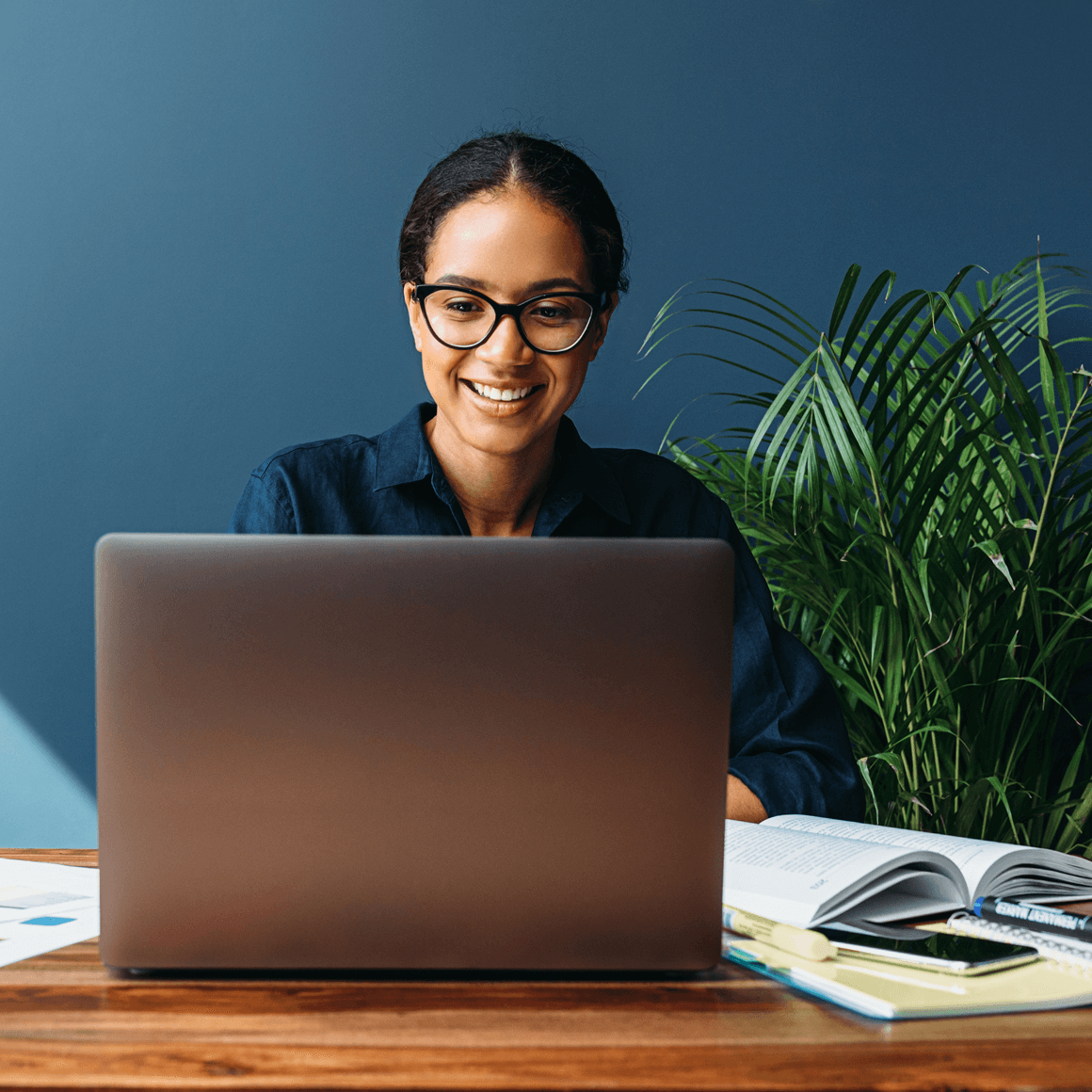 An image of a financial educator preparing her online course.