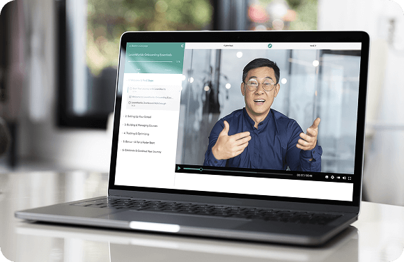 Coach speaking on a video call displayed on a laptop screen.