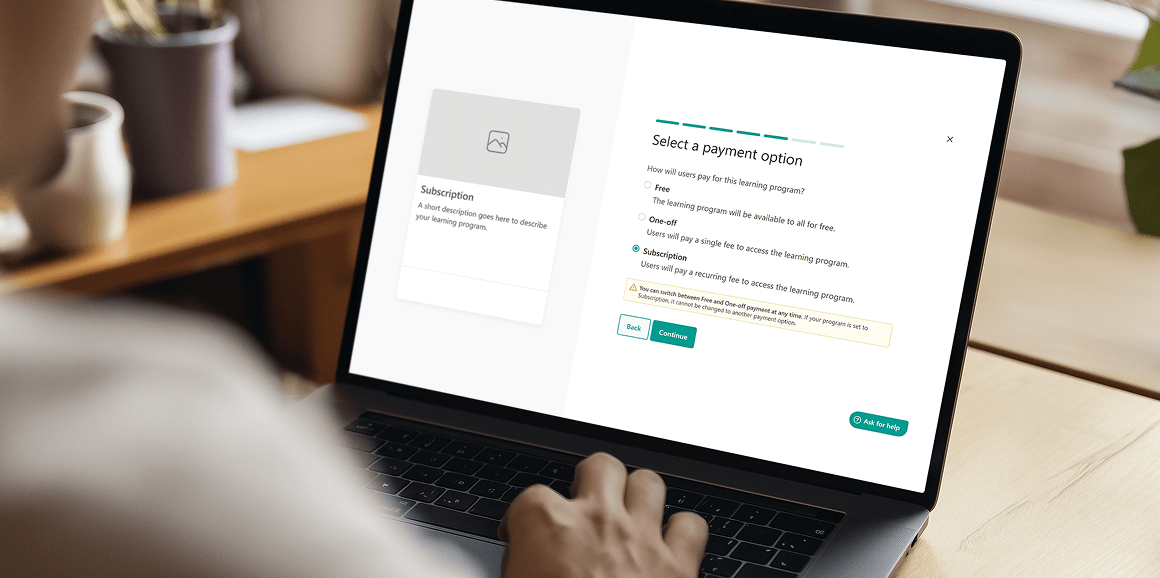 LearnWorlds platform displayed on laptop showing subscription management.