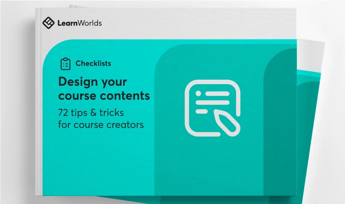 A teal-covered course-design booklet displays icons and title text while resting on a white surface.